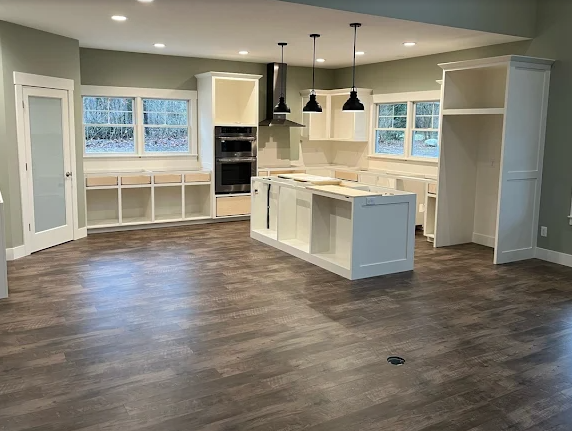 Dark stained hardwood floor in a newly built West Michigan kitchen
